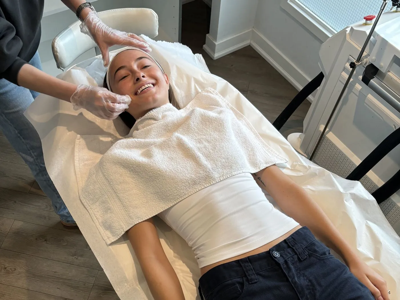 Our aesthetician finishing a treatment at the clinic in Thornhill